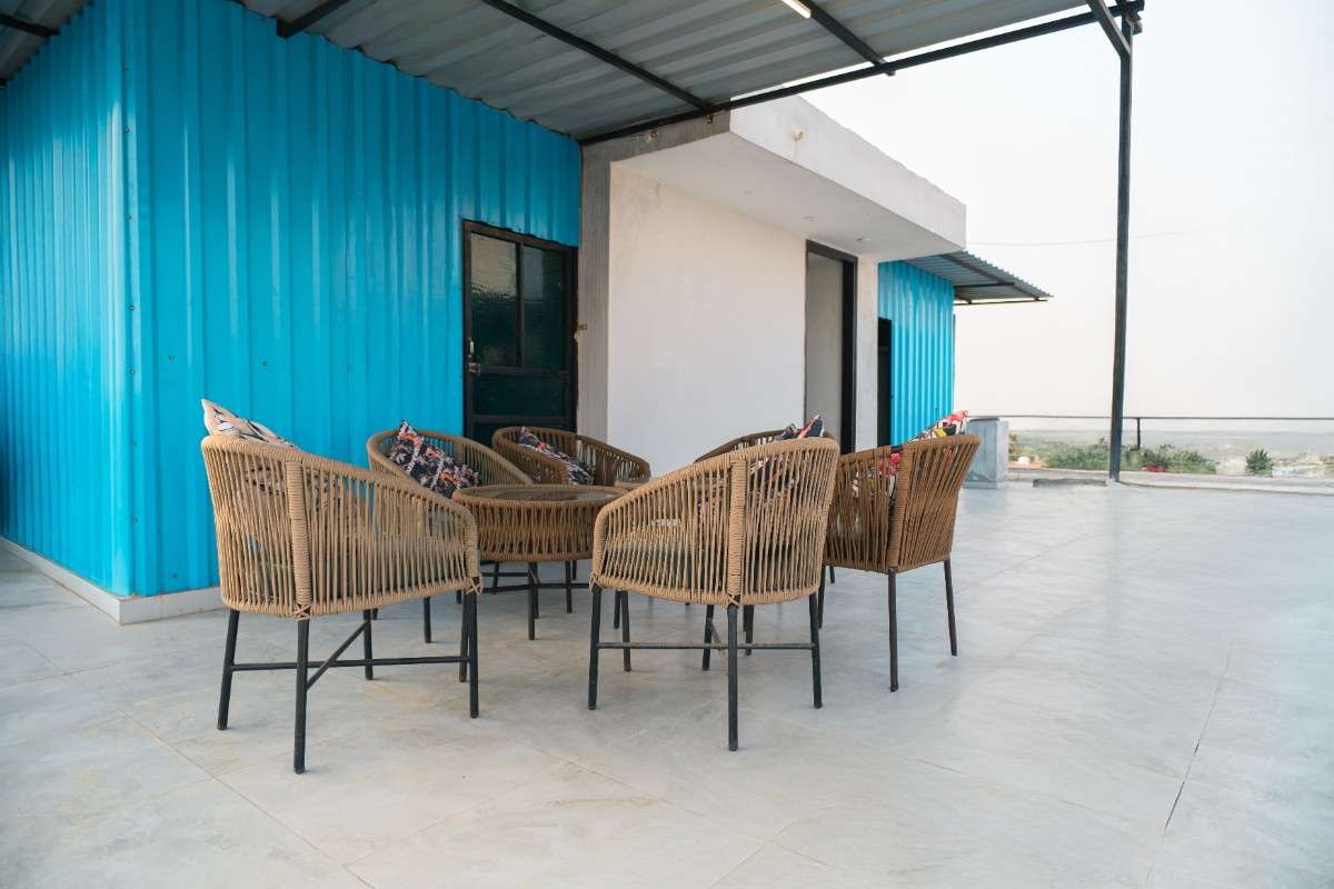 Relaxing rooftop space at PG for girls in Sector 21 with city view